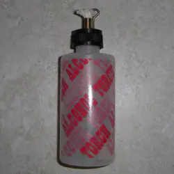 Soplete botella de alcohol